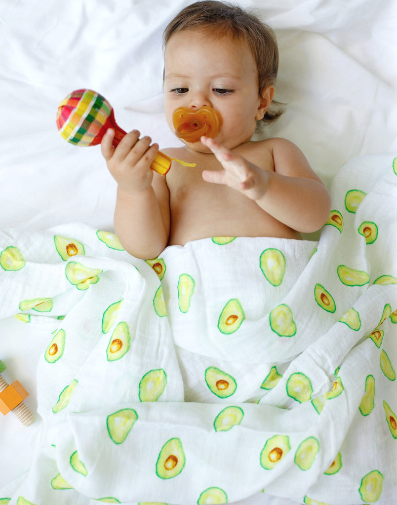 Best organic muslin swaddle blanket with adorable bee print – soft, breathable, and gentle for your baby's delicate skin. Made from premium organic cotton, this soothing swaddle features a charming watercolor avocado print, providing natural comfort, promoting safe sleep, and perfect for calming and wrapping newborns.