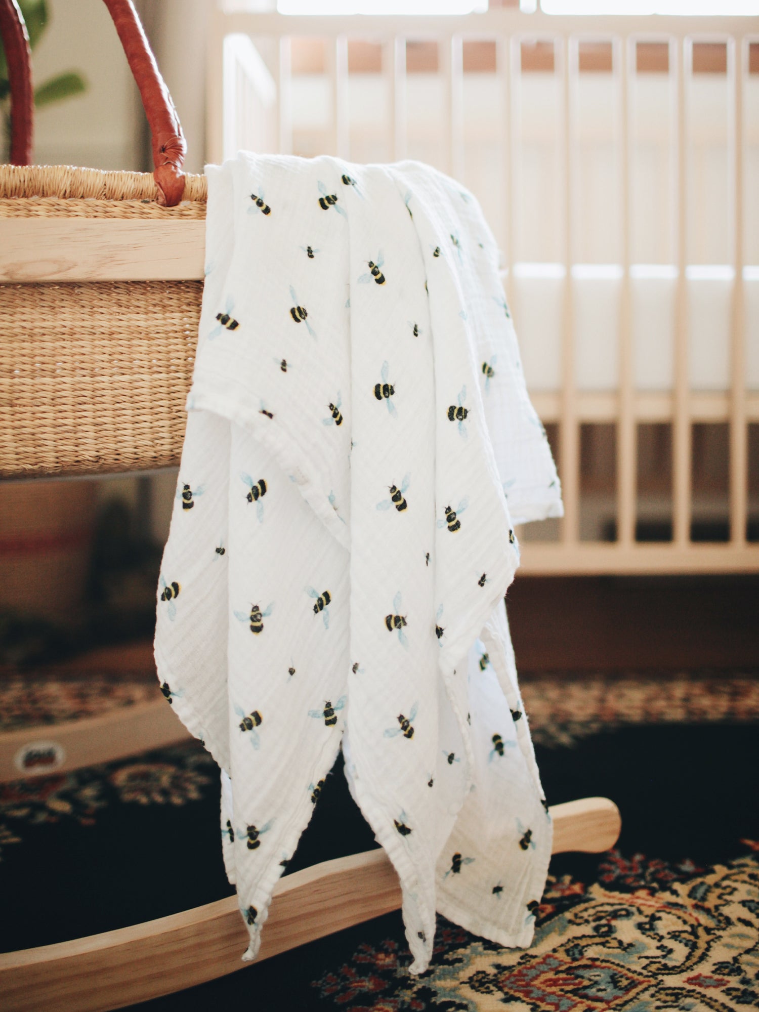 Best organic muslin swaddle blanket with adorable bee print – soft, breathable, and gentle for your baby's delicate skin. Made from premium organic cotton, this soothing swaddle features a charming watercolor bee print, providing natural comfort, promoting safe sleep, and perfect for calming and wrapping newborns.