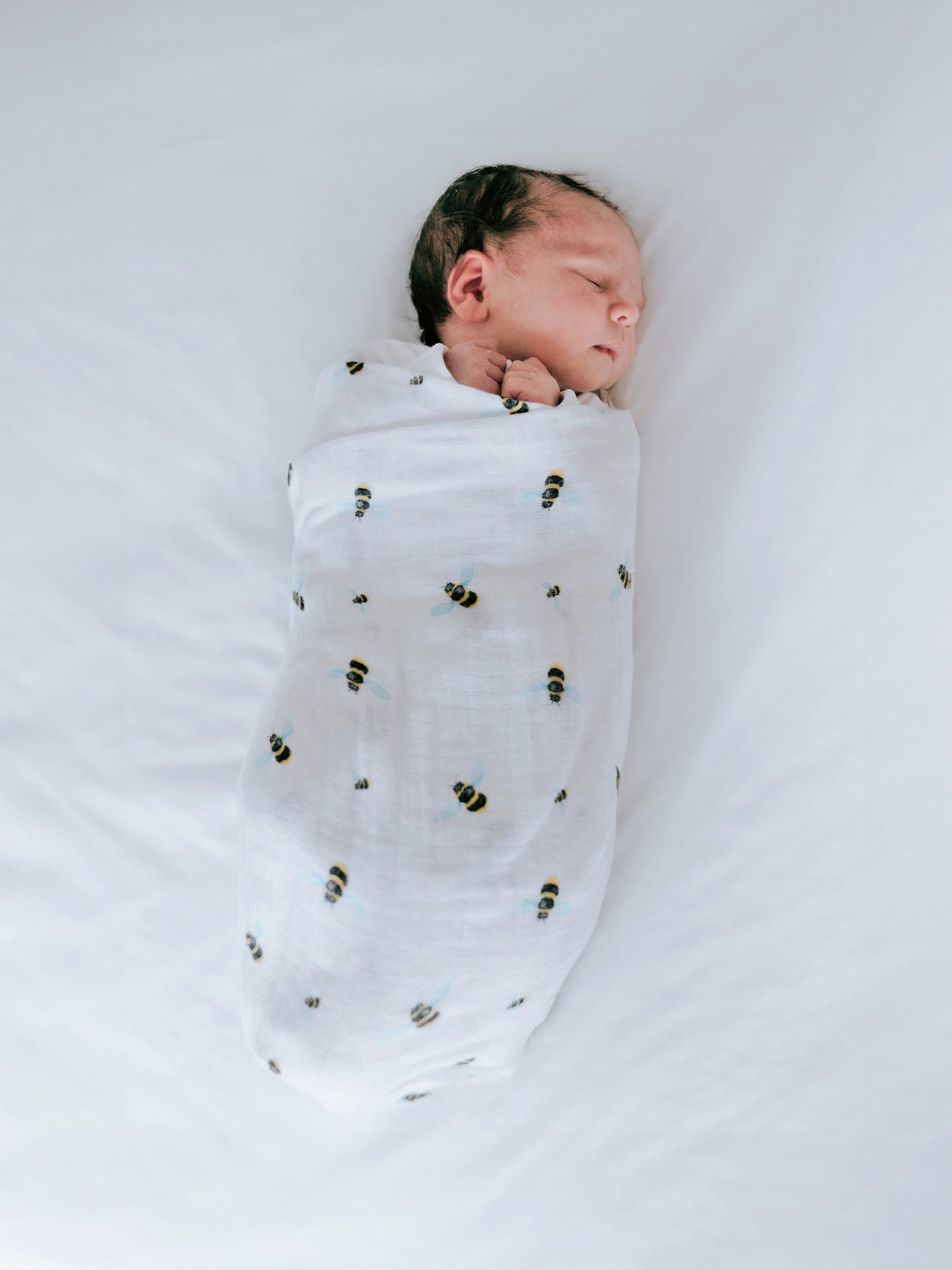 Best organic muslin swaddle blanket with adorable bee print – soft, breathable, and gentle for your baby's delicate skin. Made from premium organic cotton, this soothing swaddle features a charming watercolor bee design, providing natural comfort, promoting safe sleep, and perfect for calming and wrapping newborns.