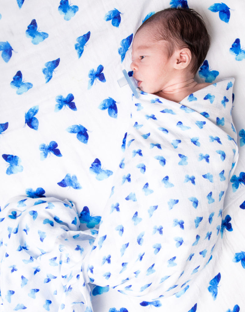 Best organic muslin swaddle blanket with adorable bee print – soft, breathable, and gentle for your baby's delicate skin. Made from premium organic cotton, this soothing swaddle features a charming watercolor butterfly print, providing natural comfort, promoting safe sleep, and perfect for calming and wrapping newborns.