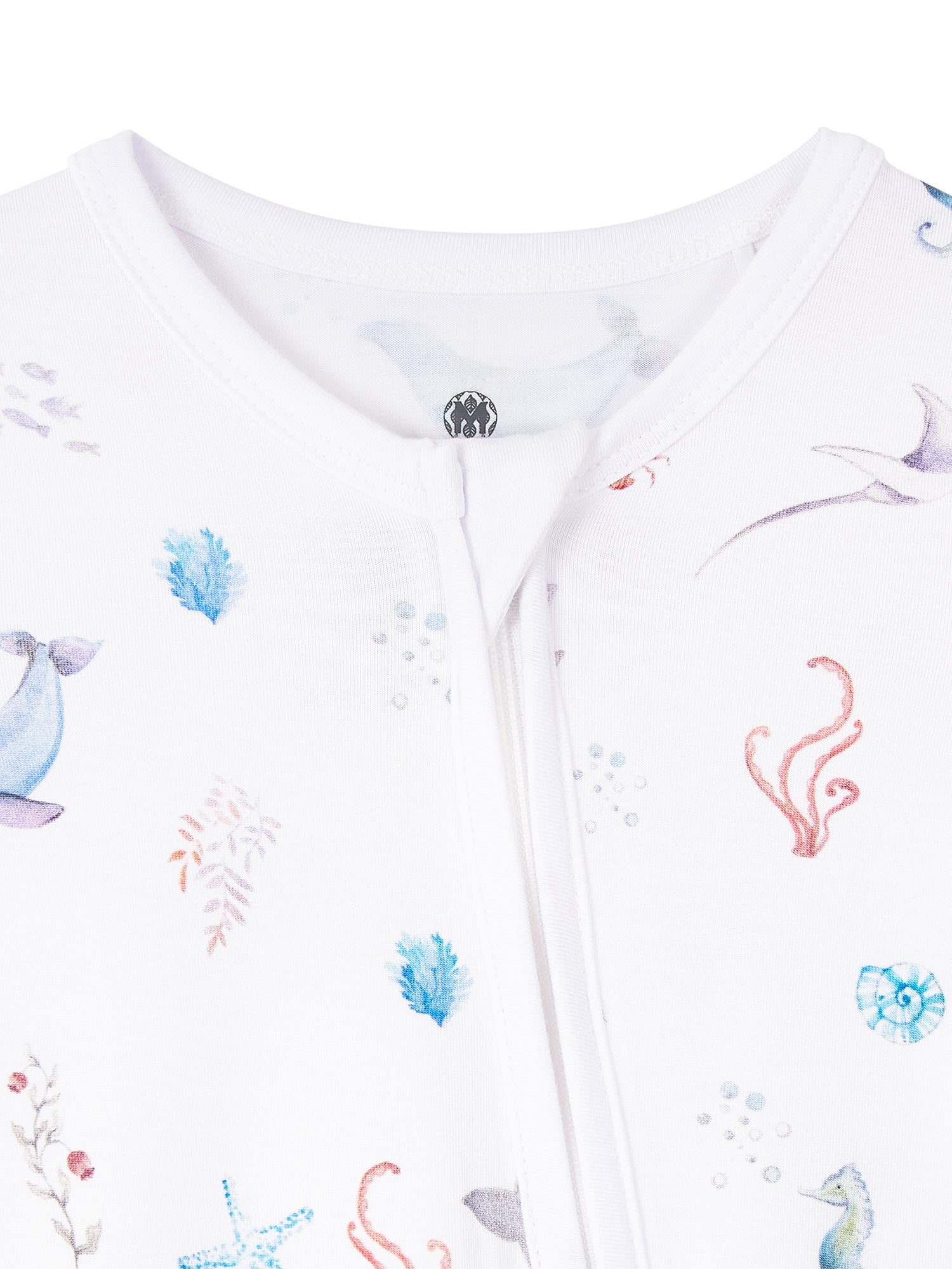 Under the Sea baby romper featuring playful ocean print, made from buttery soft bamboo cotton with a two-way zipper, foldover footie and mittens for warmth, eco-friendly dyes, and OEKO-TEX® Standard 100 certification. Perfect for newborns to 12 months, providing comfort, ease of dressing, and style for little explorers.