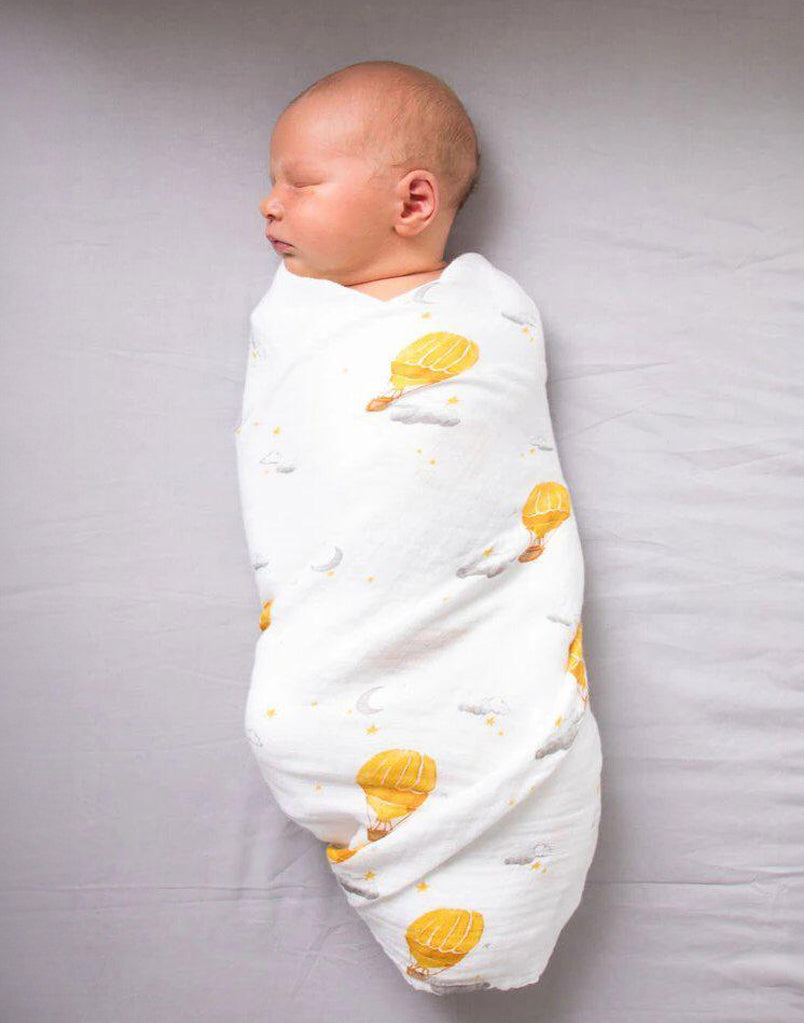 Best organic muslin swaddle blanket with adorable bee print – soft, breathable, and gentle for your baby's delicate skin. Made from premium organic cotton, this soothing swaddle features a charming watercolor hot air balloon print, providing natural comfort, promoting safe sleep, and perfect for calming and wrapping newborns.