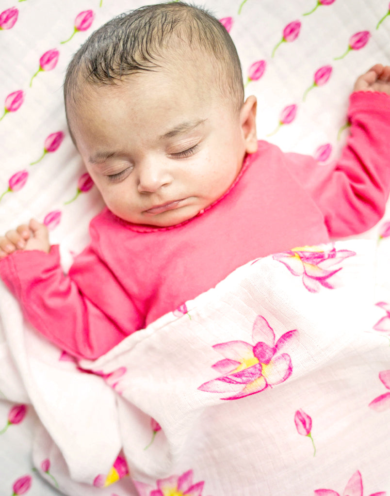 Best organic muslin swaddle blanket with adorable bee print – soft, breathable, and gentle for your baby's delicate skin. Made from premium organic cotton, this soothing swaddle features a charming watercolor lotus print, providing natural comfort, promoting safe sleep, and perfect for calming and wrapping newborns.