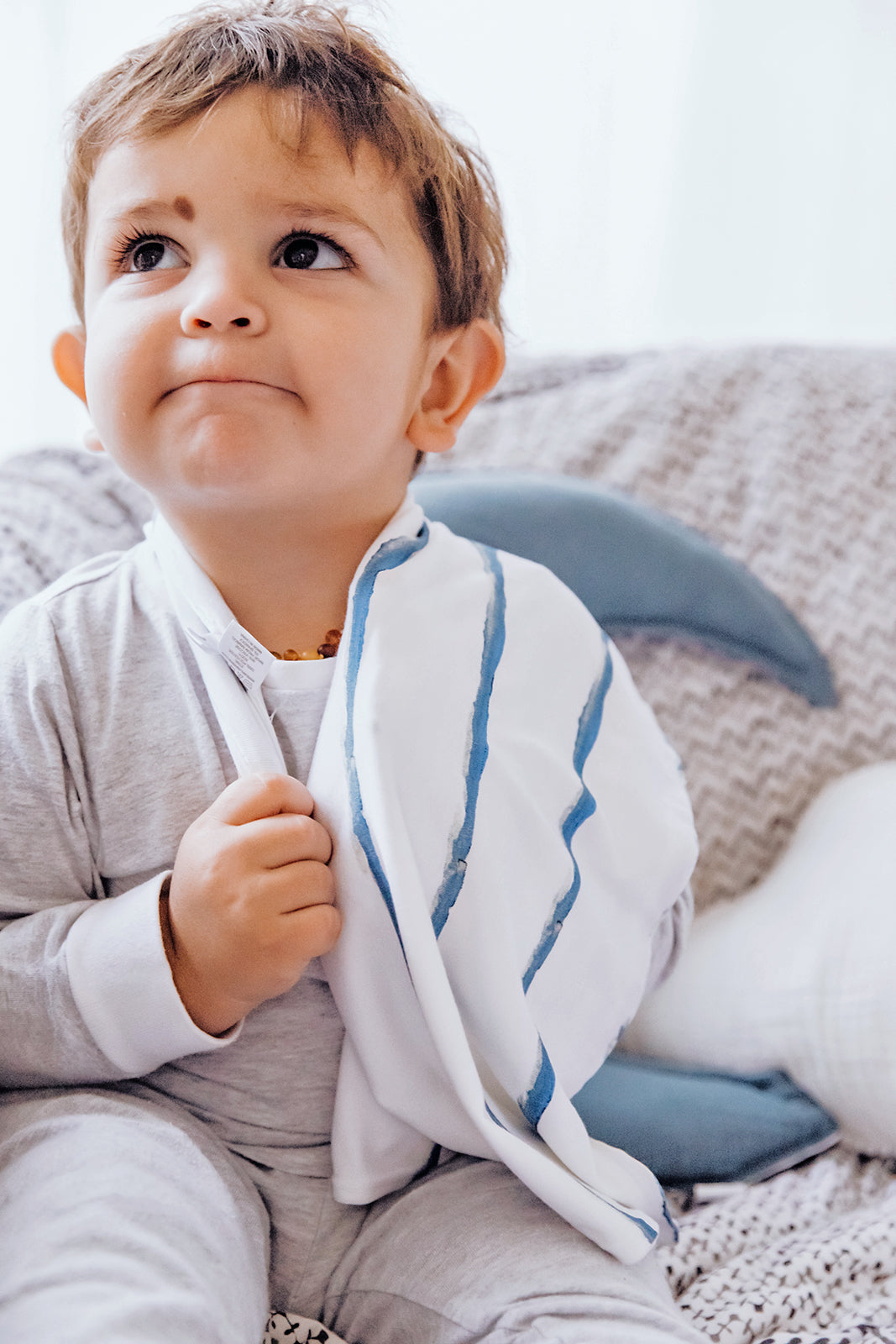 A charming baby lovey security blanket made from ultra-soft fabric, decorated with an under the sea print showcasing colorful fish, seashells, and ocean waves. This enchanting design fosters curiosity and provides comforting familiarity, making it an ideal companion for playtime and nap time.