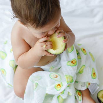 Malabar baby's 100% GOTS certified organic cotton super soft baby swaddle 2 pack. Swaddles get softer after every wash. The perfect newborn and baby shower gift. Swaddle 1 has a beautiful green avocado design and swaddle #2 has a beautiful green and white
