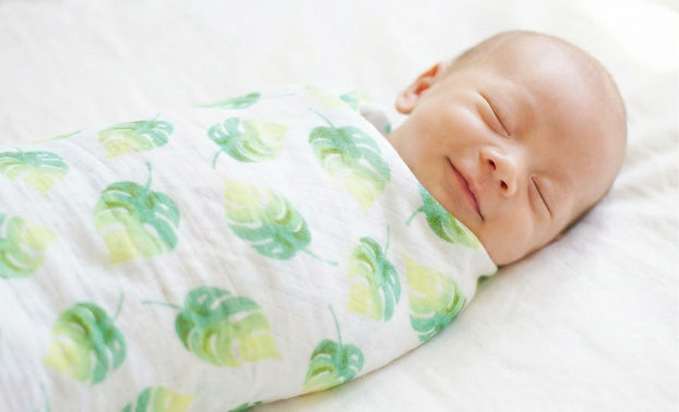 Baby Sleep Stages & Safe Sleep Tips Blog with a baby sleeping in a organic cotton muslin by Malabar Baby