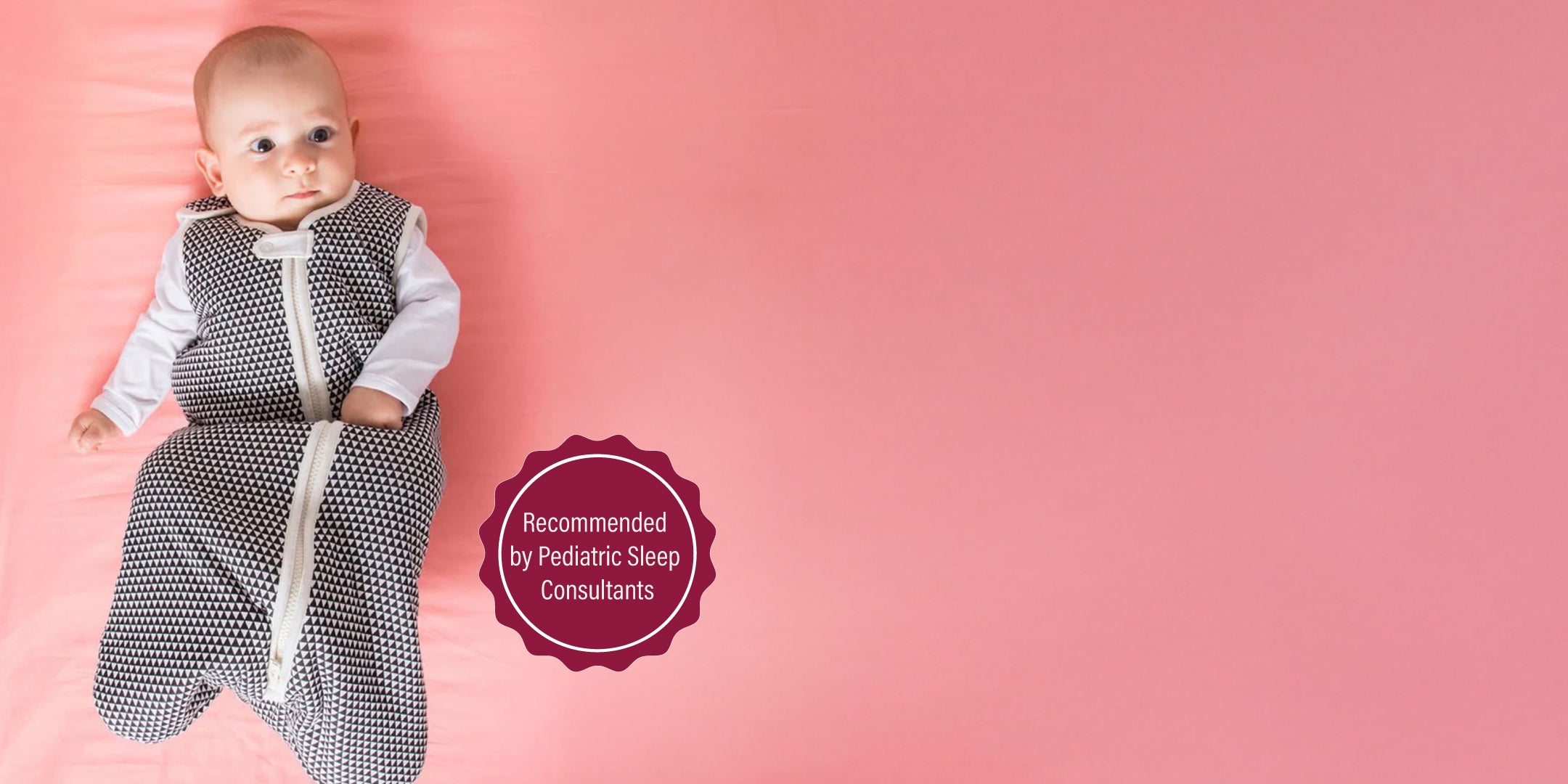 Safe sleep environment with a baby in a secure sleep sack